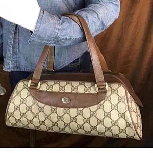 Vintage. Gucci satchel in classic brown logo.